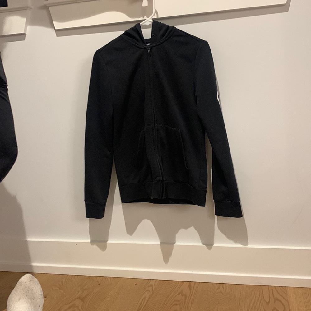 Black adidas zip up hoodie.